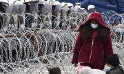 Беженцам, застрявшим в пограничной зоне, грозит смерть от холода. (© picture-alliance/dpa/Sputnik/Виктор Толочко)