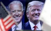 Biden and Trump on a TV screen. (© picture-alliance/dpa)
