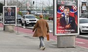 Election posters for Ivan Korčok (left) and Peter Pellegrini in Bratislava. (© picture-alliance/Sipa USA SOPA Images)