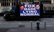 Protest sign in front of the Fox News building in New York. (© picture-alliance/ZUMAPRESS.com/Gina M Randazzo)