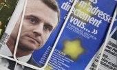 Macron on the cover of a French newspaper (© picture-alliance/dpa)