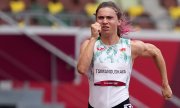 Kristina Timanovskaya Tokyo'da 100 metre koşarken. (© picture-alliance/Martin Meissner)