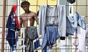 A man at a reception centre for asylum seekers in Turin on 20 September. (© picture alliance / EPA / ALESSANDRO DI MARCO)