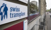 Логотип Национального фонда донорства и трансплантации органов. Берн, Швейцария. (© picture-alliance/KEYSTONE/Петер Шнайдер)