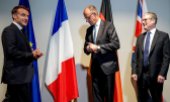 Emmanuel Macron, Friedrich Merz und Keir Starmer bei einem Treffen im Juni in Den Haag. (© picture alliance / dpa / Kay Nietfeld)