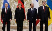 Die Staats- und Regierungschefs Russlands, Deutschlands, Frankreichs und der Ukraine unterzeichneten einen 13-Punkte-Plan für Frieden im Donbass. (© picture-alliance/dpa)