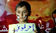 Palestinian children at a vigil mourning the death of 18-month-old Ali Saad Dawabsheh, who was reportedly killed by Jewish extremists. (© picture-alliance/dpa)