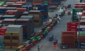 Lorries queue at the container terminal in Nanjing, China, on 8 April. (© picture alliance / Photoshot)