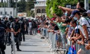 Ennahdha party activists protest outside the parliament last Sunday after Saied announced the measures. (© picture-alliance/Nicolas Fauque)