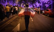 Les partisans de Rohani célèbrent la victoire de leur candidat dans les rues de Téhéran. (© picture-alliance/dpa)